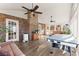 Spacious sunroom features hardwood floors, access to the exterior, a brick wall, and large windows at 4076 Shady Nw Cir, Lilburn, GA 30047