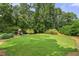 Expansive backyard with lush green grass and a playground, perfect for outdoor activities at 4343 Sprucebough Dr, Marietta, GA 30062