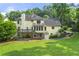 Expansive green backyard features a large deck and shade trees at 4343 Sprucebough Dr, Marietta, GA 30062