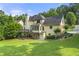 Large, lush backyard and patio area of the home, perfect for entertaining at 4343 Sprucebough Dr, Marietta, GA 30062