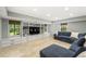 The basement living area includes built-ins, a TV, and large windows to let in natural light at 4343 Sprucebough Dr, Marietta, GA 30062