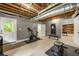 Finished basement featuring a work out area and access to an exterior door at 4343 Sprucebough Dr, Marietta, GA 30062