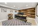 Finished basement features a home office with wood accent wall and neutral colors at 4343 Sprucebough Dr, Marietta, GA 30062