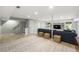 Finished basement with ample seating, neutral paint, and bright recessed lighting for a modern feel at 4343 Sprucebough Dr, Marietta, GA 30062