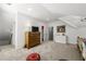 Bedroom with sloped ceilings, a large dresser, and a view into an adjacent bathroom at 4343 Sprucebough Dr, Marietta, GA 30062