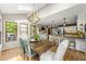 Eat-in kitchen dining area with stainless appliances, skylight, wooden table, and seating at 4343 Sprucebough Dr, Marietta, GA 30062