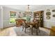 Traditional dining room featuring hardwood floors, a chandelier, and an ornate hutch at 4343 Sprucebough Dr, Marietta, GA 30062