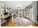 Bright home office featuring a spacious desk area, stylish furnishings, and large windows that offer a lot of natural light at 4343 Sprucebough Dr, Marietta, GA 30062