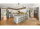 Open kitchen with stainless steel appliances, an island with seating, and modern finishes at 4343 Sprucebough Dr, Marietta, GA 30062