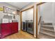 Laundry room featuring a modern washer and dryer, as well as a decorative cabinet and hanging Laundry Room sign at 4343 Sprucebough Dr, Marietta, GA 30062
