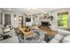 Inviting living room featuring a cozy fireplace, stylish sofas, area rug, and built-in shelving at 4343 Sprucebough Dr, Marietta, GA 30062