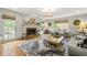 Cozy living room with a brick fireplace, neutral decor, and ample natural light at 4343 Sprucebough Dr, Marietta, GA 30062