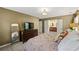 Large primary bedroom with ensuite bath access, carpeting, and ample natural light at 4343 Sprucebough Dr, Marietta, GA 30062