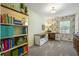 Cozy home office featuring built-in shelving, decorative wallpaper, and lots of natural lighting at 4343 Sprucebough Dr, Marietta, GA 30062