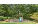 Backyard featuring a wooden playground with slide, swings, and climbing ladder at 4343 Sprucebough Dr, Marietta, GA 30062