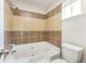Bathroom with tile surround shower tub and toilet at 8455 Cedar Creek Rdg, Riverdale, GA 30274