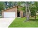Charming single-story home featuring a well-maintained lawn and inviting curb appeal at 8455 Cedar Creek Rdg, Riverdale, GA 30274