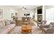 Cozy living room featuring a stone fireplace and an open floor plan at 8455 Cedar Creek Rdg, Riverdale, GA 30274