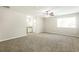 Large main bedroom with carpeting, a ceiling fan, and en-suite bathroom at 8455 Cedar Creek Rdg, Riverdale, GA 30274