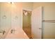 Bathroom featuring sink, mirror and view into adjacent carpeted bedroom at 179 Camry Ln, Grayson, GA 30017