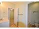 Bathroom featuring tub/shower combo and sink with access to carpeted bedroom at 179 Camry Ln, Grayson, GA 30017