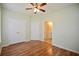Cozy bedroom with hardwood flooring, a ceiling fan, closet and easy access to an ensuite bath at 179 Camry Ln, Grayson, GA 30017