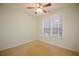 Cozy bedroom with natural light, ceiling fan, and neutral carpet at 179 Camry Ln, Grayson, GA 30017