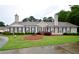 Charming single-story home with well-manicured lawn and mature landscaping creates great curb appeal at 179 Camry Ln, Grayson, GA 30017