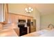 Bright kitchen features wood cabinetry, stainless steel appliances, and ample counter space at 179 Camry Ln, Grayson, GA 30017