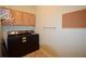 Functional laundry room equipped with washer, dryer, storage cabinets, and tile flooring at 179 Camry Ln, Grayson, GA 30017