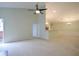 Inviting open concept living area with vaulted ceilings and seamless transition to the adjacent kitchen at 179 Camry Ln, Grayson, GA 30017
