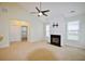 Bright living room with vaulted ceiling, fireplace, neutral carpet, and large windows at 179 Camry Ln, Grayson, GA 30017