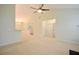 Neutral interior, spacious living area with vaulted ceiling and view into adjacent rooms at 179 Camry Ln, Grayson, GA 30017