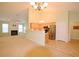 Open concept living and kitchen area featuring a cozy fireplace and modern appliances at 179 Camry Ln, Grayson, GA 30017