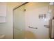 Modern shower with a glass door, convenient grab bars, and built in soap dispensers at 179 Camry Ln, Grayson, GA 30017