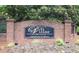 Entrance to community, brick sign that says 'The Villas at Pebble Creek Farm' at 179 Camry Ln, Grayson, GA 30017
