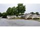 Street view of community with lush trees and well-maintained exteriors at 179 Camry Ln, Grayson, GA 30017