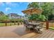 Outdoor dining area on a spacious back deck with views of the green backyard at 2535 Winthrope Way, Lawrenceville, GA 30044