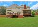 Spacious backyard with a large deck and screened porch for outdoor enjoyment at 2535 Winthrope Way, Lawrenceville, GA 30044