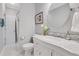 Bathroom featuring marble countertop vanity and tiled floors leading to a glass enclosed shower at 2535 Winthrope Way, Lawrenceville, GA 30044