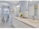 Bright bathroom with double vanity, blue walls, and tiled shower at 2535 Winthrope Way, Lawrenceville, GA 30044