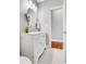Bathroom featuring marble countertop vanity and tiled floors with decorative lighting at 2535 Winthrope Way, Lawrenceville, GA 30044