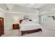 Bright bedroom with tray ceilings, a large bed, and a window with natural light at 2535 Winthrope Way, Lawrenceville, GA 30044