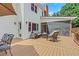 Deck area with space for outdoor seating and relaxation, with a screened porch to the right at 2535 Winthrope Way, Lawrenceville, GA 30044