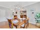 Dining room featuring a wooden table set for dinner at 2535 Winthrope Way, Lawrenceville, GA 30044