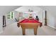 Entertainment space featuring a pool table, seating area, and lots of natural light at 2535 Winthrope Way, Lawrenceville, GA 30044