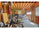 Unfinished garage with exposed framing, concrete floor, and a variety of stored items, offering potential for customization at 2535 Winthrope Way, Lawrenceville, GA 30044