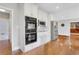 Kitchen featuring white cabinets and stainless steel appliances with hardwood floors at 2535 Winthrope Way, Lawrenceville, GA 30044