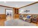Living room with hardwood floors, comfortable seating, and a view to the dining room at 2535 Winthrope Way, Lawrenceville, GA 30044