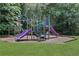 Colorful playground with slides and climbing structures surrounded by green grass, offering a fun and safe play area at 2535 Winthrope Way, Lawrenceville, GA 30044
